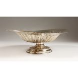 A VICTORIAN IVAK SEMI-FLUTED PEDESTAL FRUIT BOWL. 11ins wide. London 1897. Weight 12ozs.