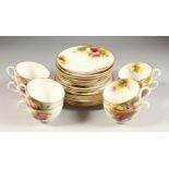 A ROYAL WORCESTER TEA SET, eight cups and eight saucers, six plates, all painted with roses. One