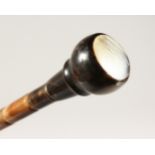 A BONE HANDLED WALKING CANE. 33ins long.