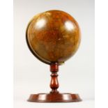 A LATE VICTORIAN TERRESTRIAL TABLE GLOBE, by G. F. CRUCHLEY, CIRCA. 1880, on a turned wood base.