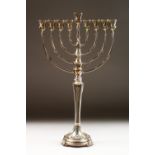 A STERLING .925 SILVER MENORAH. 21inshigh.