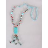A TURQUOISE AND RED NECKLACE.