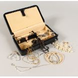 A LEATHER JEWELLERY CASE AND BIJOUTERIE.