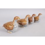 A SET OF FOUR WALTON TYPE SMALL POTTERY DUCK TUREEN AND COVERS. 3.5ins long.