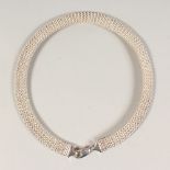 A SILVER CHOKER.