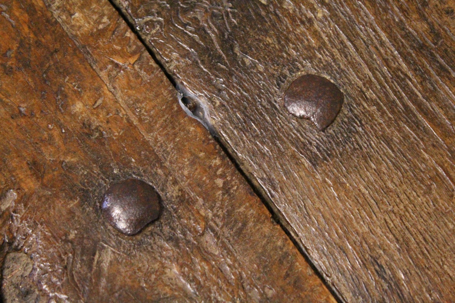 A 16TH CENTURY OAK RUSTIC LOW TABLE, with plank top over a drawer with carved decoration, a circular - Image 3 of 7