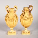 A GOOD PAIR OF 18TH CENTURY EUROPEAN CARVED IVORY VASES, carved with fruiting garlands. 4.5ins