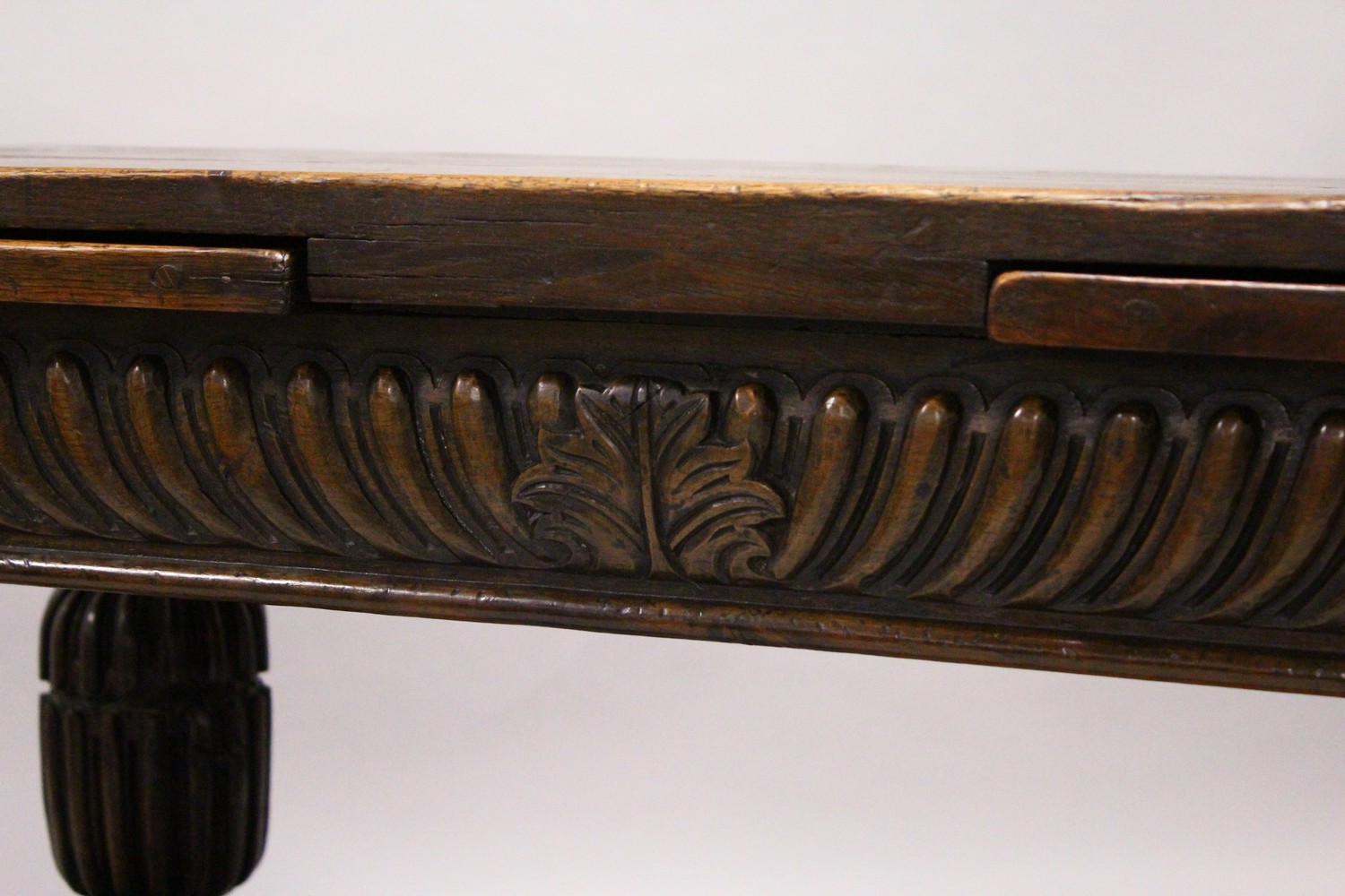 A GOOD 17TH/18TH CENTURY OAK DRAW LEAF TABLE, with a plain rectangular top, carved frieze on four - Image 2 of 9