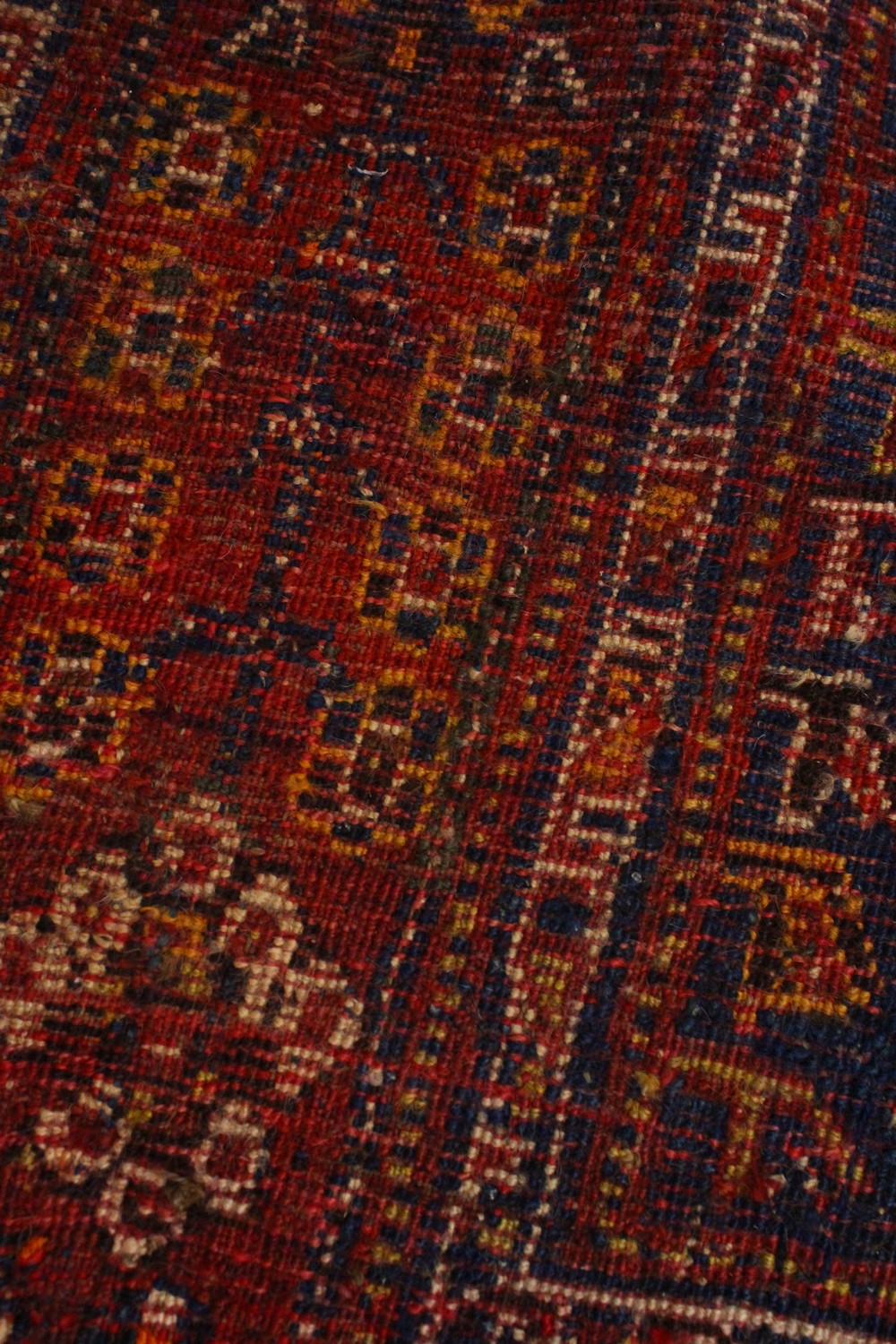 A PERSIAN CARPET, blue and red ground, decorated with stylised motifs. 8ft 3ins x 5ft 3ins. - Image 3 of 4