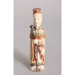 A CHINESE CARVED AND STAINED IVORY FIGURE SNUFF BOTTLE. 4ins high.