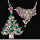 A SILVER RUBY SET CHRISTMAS TREE PENDANT AND CHAIN and ROBIN BROOCH.