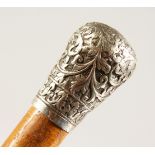 A WALKING CANE, with silver handle. 37ins long.
