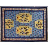 A GOOD CHINESE CARPET, pale blue ground with four panels, decorated with dragons chasing the