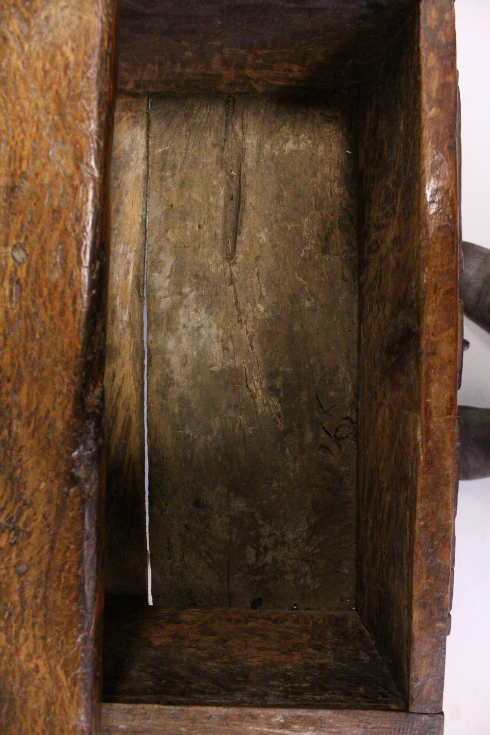 A 16TH CENTURY OAK RUSTIC LOW TABLE, with plank top over a drawer with carved decoration, a circular - Image 6 of 7