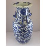 ORIENTAL BLUE AND WHITE VASE WITH RELIEF DRAGON DECORATION AND DOG OF FOE HANDLES, APPROX. 35.5 cm
