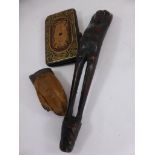 EMBOSSED AND TOOLED LEATHER CARD PURSE, ANIMAL FOOT BROOCH AND A CARVED WOODEN FIGURE, POSSIBLY