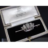 ROYAL NAVY BROOCH, 15CT GOLD SET WITH DIAMONDS AND RED AND GREEN STONES IN FITTED LONGHAM &