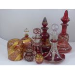 COLLECTION OF RUBY AND CRANBERRY GLASS PERFUME BOTTLES, DRESSING TABLE POTS AND A JUG, SOME