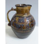 19TH CENTURY TREACLE GLAZED HARVEST JUG WITH MOTTO 'FILL ME FULL OF LIQUOR SWEET FOR THAT IS GOOD