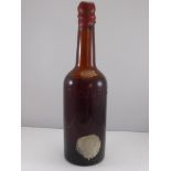 AN INTERESTING BOTTLE WITH UNKNOW CONTENTS, POSSIBLY WHISKY OR PORT, WAX SEALED TOP, BROWN GLASS