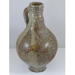 17TH CENTURY GERMAN SALT GLAZED BELLARMINE JUG WITH MASK AND CREST DECORATION, APPROX. 22 cm