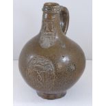 18TH CENTURY GERMAN BOTTLE SHAPED BELLARMINE JUG/ BARTMANNSKRUG DECORATED WITH MASK AND SEAL WITH GR