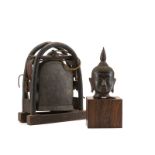 Two Asian objects, elephant bell and Buddha head