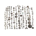 A group of Native American silver and metal buttons