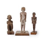 Three Egyptian wooden figural carvings