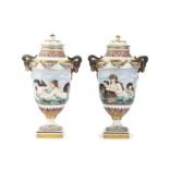 A pair of Volkstedt porcelain lidded urns