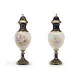A pair of Sevres-style gilt bronze-mounted porcelain urns