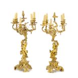 A pair of gilt bronze candelabra