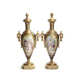 A pair of Sevres porcelain and champleve enamel urns