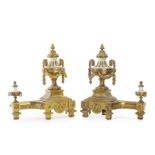 A pair of Louis XVI-style gilt-bronze and onyx chenets