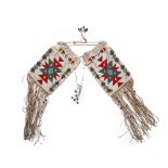 A pair of beaded Plains saddle bags with fringe