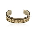 A sterling silver and 14k gold cuff bracelet