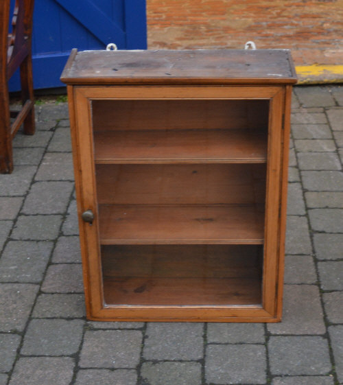 Pine glass fronted wall cabinet