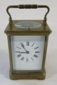 Brass repeating carriage clock retailed by Goldsmiths,