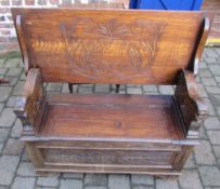 Oak monks bench with carved lion supports