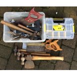 Various tools including hammers, saws,