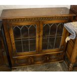 Oak and leaded glass display cabinet