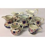 6 Victorian gaudy welsh jugs (3 with names) & a tankard