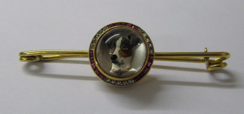 Tested as 9ct gold reverse crystal intaglio brooch of a jack russell dog surrounded by diamond and