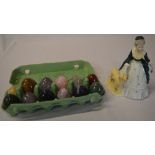 Quantity of polished hardstone eggs and a Coalport figure of a lady