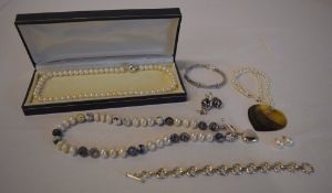 Silver bracelet, pair of white metal earrings, pair of silver and pearl earrings,