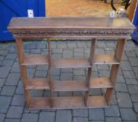 Wall shelf unit with carved pediment