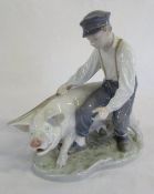 Royal Copenhagen figurine of a boy with a pig no 848