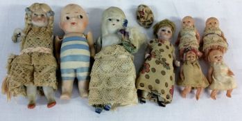 4 miniature early 20th century bisque dolls & 4 miniature plastic baby dolls