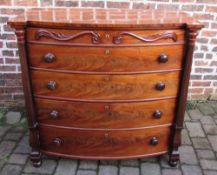 Victorian bow fronted mahogany chest of drawers with turned handles and flanked by columns