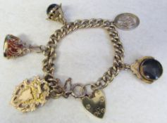 9ct gold charm bracelet with 9ct gold fobs etc total weight 58.